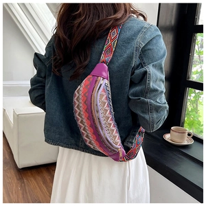 Detail of bohemian purple woven waist bag with colorful diamond pattern wide shoulder strap