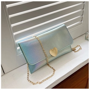 Detail of laser gradient texture and golden heart metal buckle on a small wallet