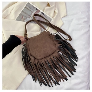 Close-up of dark brown suede saddle bag with dense dual-tone fringe and gold buckles