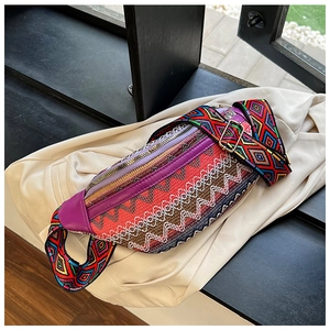 Detail of ethnic embroidery waist bag with geometric weaving and wide jacquard strap