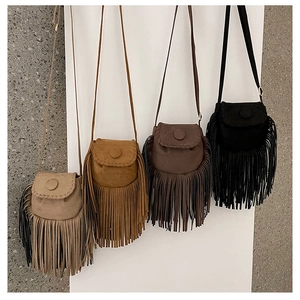 Detailed display of four bohemian suede saddle bags with stylish long tassels in diverse colors