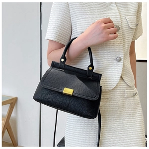 Black lychee texture leather handbag featuring a gold metal lock and elegant top handle