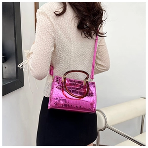Hot pink metallic faux crocodile leather handbag with tortoiseshell resin circular handles