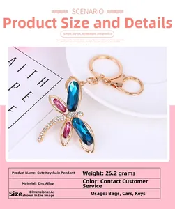 Detail of dragonfly keychain with blue teardrop crystals and gold zinc alloy clasp