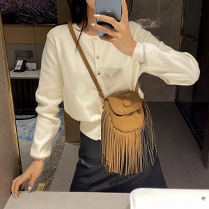 Brown suede crossbody saddle bag with long tassels and bohemian fringe detailing