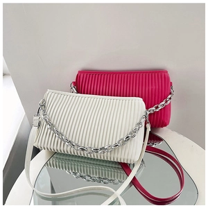 Detail of pleated design women's crossbody bags in white and rose pink colors