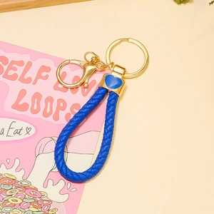 Porte-clés en cuir tressé bleu foncé avec attaches dorées en alliage de zinc