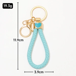 Porte-clés cœur en cuir tressé bleu avec fermoir doré et dimensions du produit