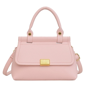 Pale pink lychee grain crossbody handbag with top handle and gold metal twist lock closure