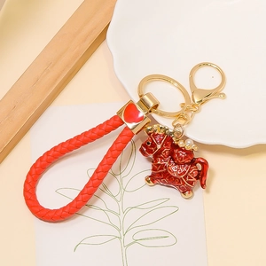 Traditional red Chinese zodiac horse keychain with woven rope and golden metal heart