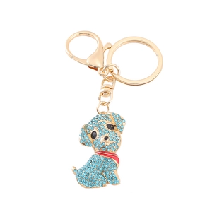 Porte-clés chien doré orné de strass bleu ciel et d'un collier en émail rouge