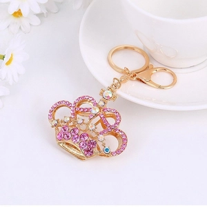 Elegant gold crown keychain with pink rhinestones, lobster clasp and ring accessories