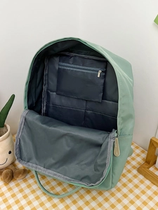 Light green contrast school backpack with interior compartments and spacious storage