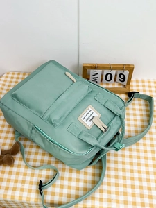 Pastel mint green large capacity school backpack for college students with front pocket