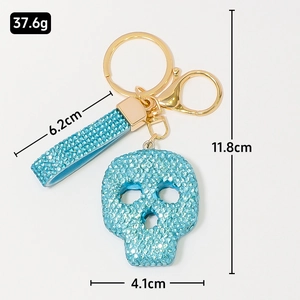 Porte-clés tête de mort bleu clair étincelant avec strass et anneau doré pour cadeau