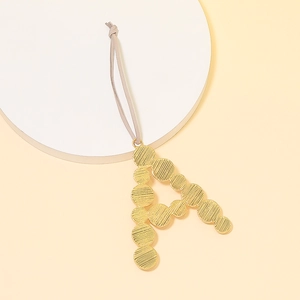 Golden pearl style letter A keychain pendant with wave texture and grey suede strap