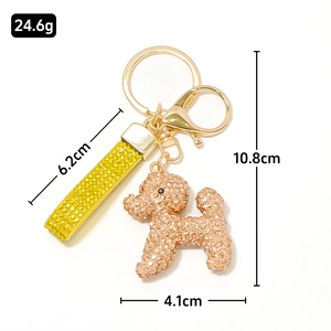 Porte-clés chien doré scintillant avec lanière jaune en strass et dimensions
