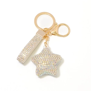 Macro view of crystal star keychain with rainbow rhinestones and gold lobster clasp
