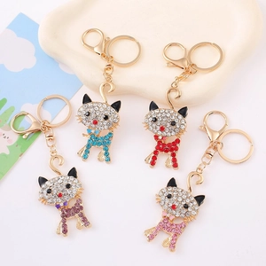 Detailed view of colorful rhinestone cat keychains with alloy gold base in four colors