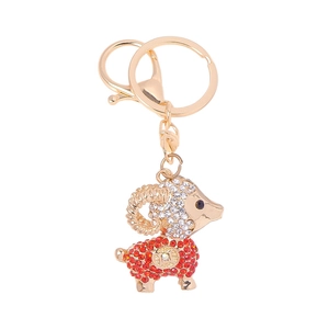 Porte-clés mouton porte-bonheur plaqué or avec strass brillants et cordon en cuir rouge