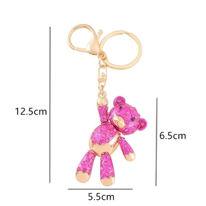 Porte-clés ours rose avec strass et fermoir homard doré avec détails de mesures