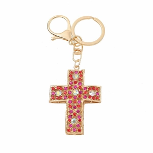 Ornate hollow cross keychain with red and pink rhinestones on a gold metal base