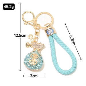 Kreativer blauer Strass-Geldbeutel-Schlüsselanhänger mit USD-Symbol und Lederband