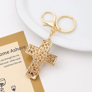 Elegant gold hollowed cross keychain with lace pattern, lobster clasp and metal ring