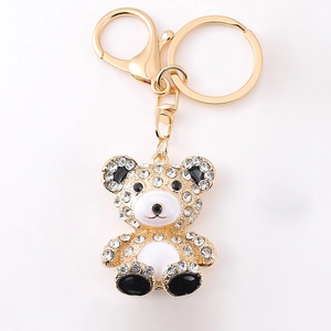 Porte-clés ours étincelant en métal doré orné de strass et émail blanc chic