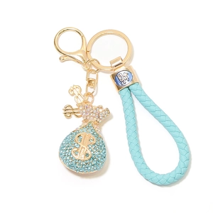 Detail der blauen Strass-Geldtasche Schlüsselanhänger mit Dollarzeichen und Lederband