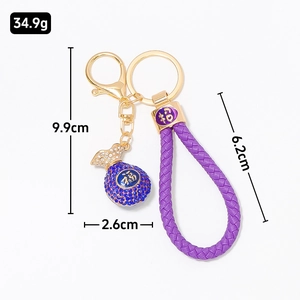 Chinese style lucky bag keychain with purple leather strap and blue rhinestone pendant