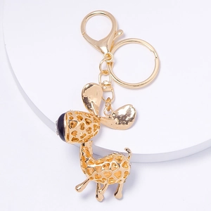Porte-clés girafe doré avec motif alvéolé évidé et accents en strass étincelants