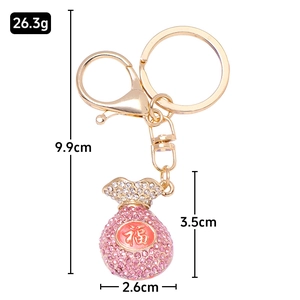 Detailed view of pink rhinestone lucky bag keychain with dimensions 3.5cm x 2.6cm