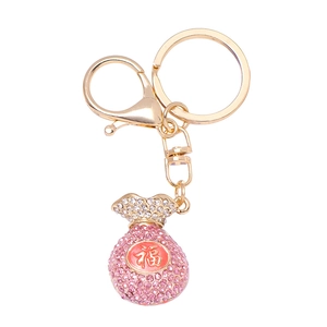 Porte-clés sac à bijoux doré avec strass roses et caractère chinois de bonne fortune