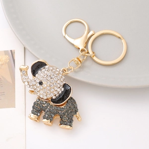 Golden elephant keychain with sparkling grey rhinestones and black enamel accents