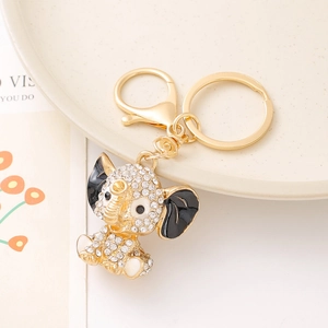 Golden elephant keychain with rhinestones and black enamel detail for bag charms