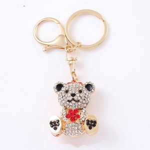 Sparkling crystal teddy bear keychain with gold alloy finish and floral rhinestone inlay