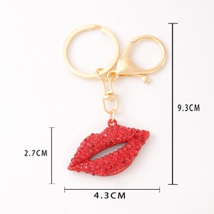 Detail showing red rhinestone lips keychain with gold lobster clasp and dimensions