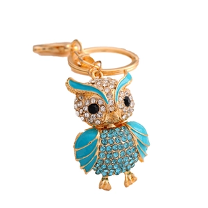 Charming golden owl keychain with sparkling blue and clear crystals on a metal ring