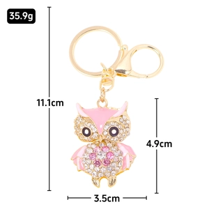 Enameled owl keychain with rhinestones and size measurements on white background