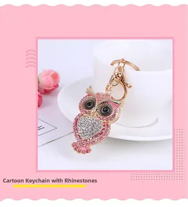 Detailed view of pink owl keychain with sparkling rhinestones and golden metal lobster clasp