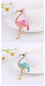 Detail of flamingo keychains featuring sparkling rhinestones and colorful enamel accents