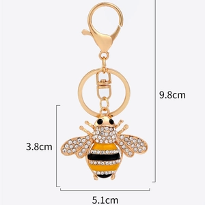 Elegant gold-plated bee keychain with sparkling rhinestones and black enamel accents