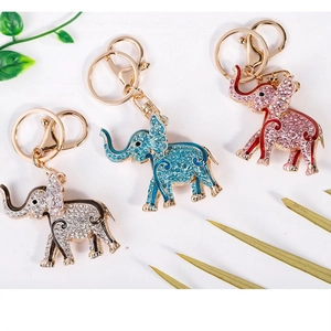 Sparkly elephant keychains with colorful rhinestones and gold rings in three colors