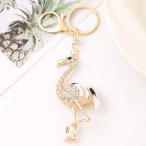 Creative flamingo keychain with rhinestones and white enamel on a gold metal link
