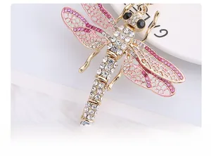Detailed macro view of the dragonfly wings with pink enamel and sparkling rhinestones