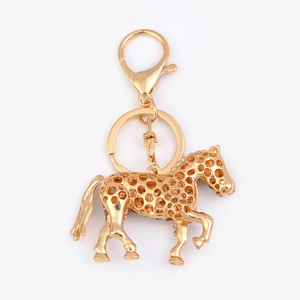Golden horse zodiac keychain with cutout dot pattern and metal lobster clasp accessory