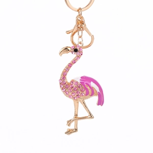 Charming gold flamingo keychain with pink rhinestones and enamel finish for handbags