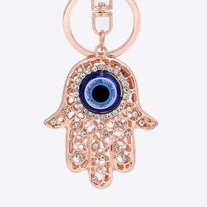 Hamsa-Hand-Schlüsselanhänger in Roségold mit funkelnden Strasssteinen und bösem Auge