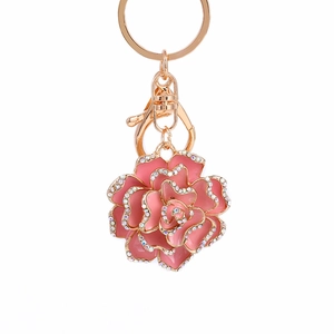 Pink enamel rose flower keychain with gold hardware and sparkling rhinestone edges